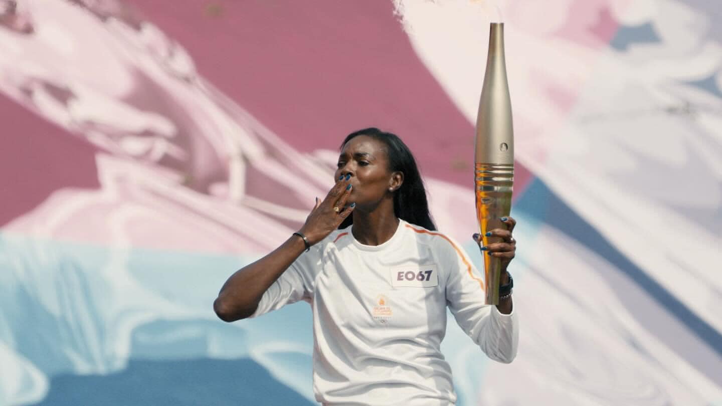 Fabé carrying Olympic torch